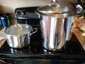 Hot liquor being brought to a boil on the left, jar sanitize water on the right.